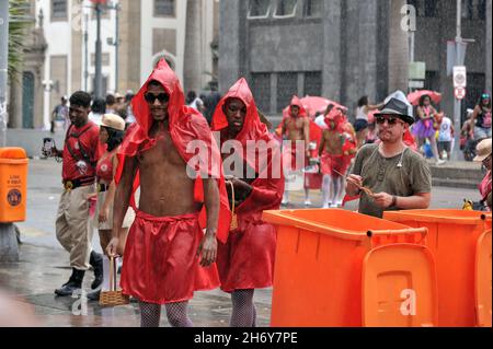 February 22, 2020: Not even the rain can dull the beauty of Brazilian carnival.Revelers enjoy every moment of the party held in central Rio de Janeiro Stock Photo