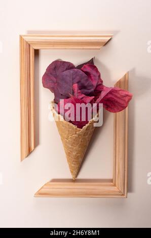 ice cream from colored autumn leaves in trendy color on a beige background. minimalistic concept. Stock Photo