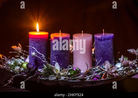 advent cristian concept with 1 pink candle and 3 purple candles Stock Photo