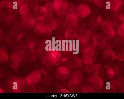 Texture created from oval red objects. The effect was obtained by photographing the glitter surface in a macro scale without focusing. Stock Photo