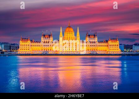 Budapest, Hungary. Colored sky night view on Parliament building over delta of Danube River. Stock Photo