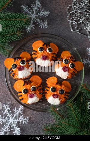 Christmas Sandwiches 2022 Tiger Sandwiches For New Year 2022 Of Carrot, Eggs And Black Olives On  White Bread On Brown Background, Top View Stock Photo - Alamy
