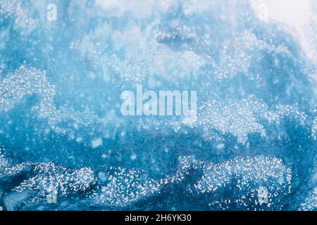 Abstract ocean waves painted on wooden canvas, close up Stock Photo