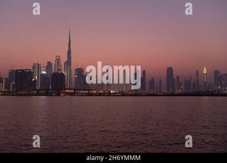 Panoramic view Burj Khalifa and city skyline at twighlight Dubai Creek UAE