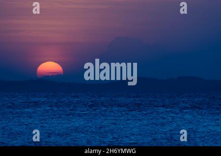 Sunset seen from Ribeira beach in Salvador, Bahia, Brazil. Stock Photo