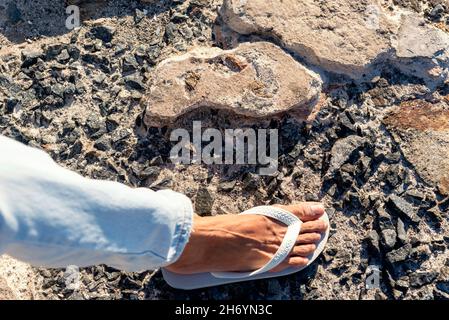 Close Up of texture of stones and a human foot on the ground. Salvador, Bahia, Brazil. Stock Photo