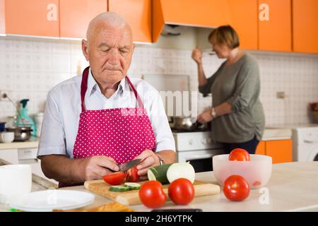 Senior couple cooking together Stock Photo