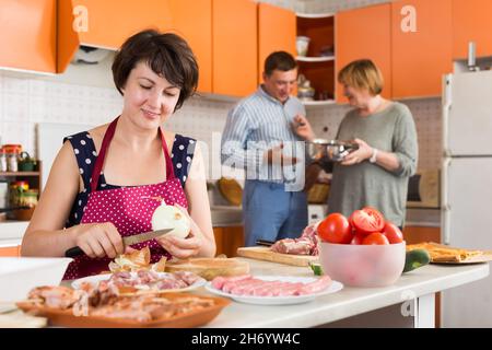 Family making dinner together Stock Photo