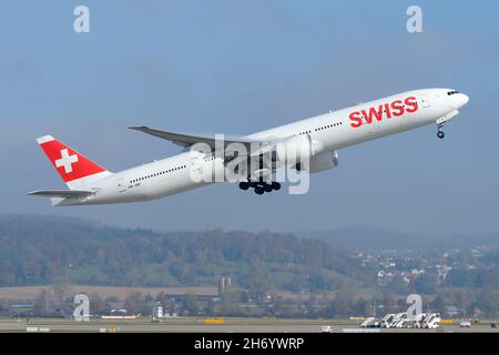 Swiss Airlines Boeing 777-300ER aircraft taking off from Zurich Airport. Airplane belonging to Swiss Iternational Air Lines departing Switzerland. Stock Photo