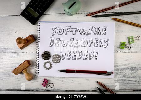 Software Developers Needed. Job Offer Concept. Office Desk. Stock Photo