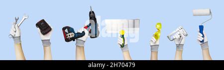 Gloved hands holding set construction tools spatula, goggles, roller, stapler, job, work, house, repair, handyman, work tool, trowel, wrench spanner s Stock Photo