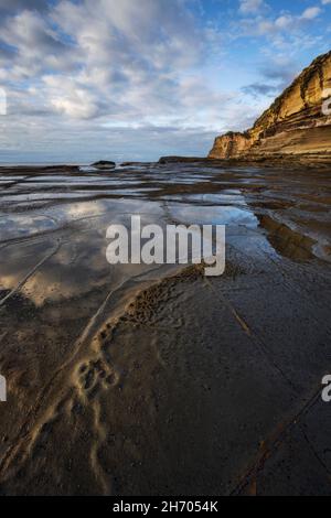 reflections in the water near cliff at terrigal on nsw central coast Stock Photo