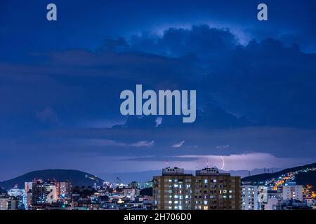 Arrival of a strong storm with lightning and rain. These weather conditions are typical of the Brazilian summer. Stock Photo