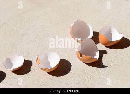 Cracked chicken egg shells background Stock Photo