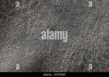 Macro background made of seamless wavy black natural leather. Stock Photo