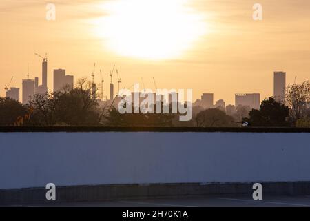 High-rise office buildings and construction cranes on the skyline of Croydon taken as sunset in Beckenham, London, United Kingdom Stock Photo