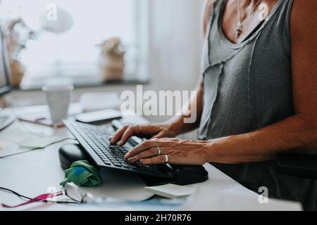 Woman's hands using computer Stock Photo
