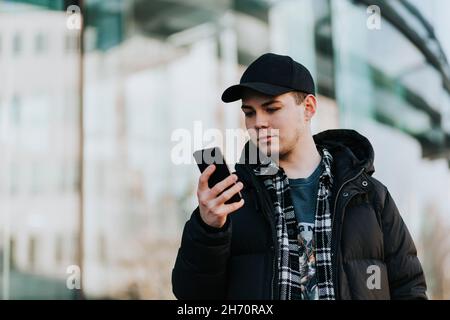 Man looking at his phone Stock Photo