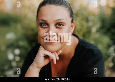 Portrait of smiling young woman Stock Photo