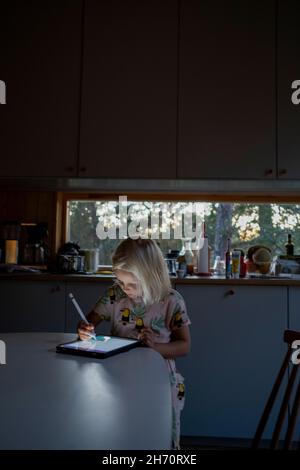 Girl using digital tablet Stock Photo