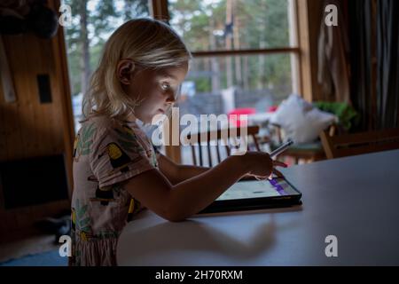 Girl using digital tablet Stock Photo