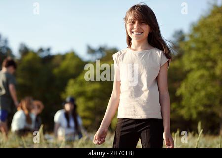 Smiling girl looking at camera Stock Photo