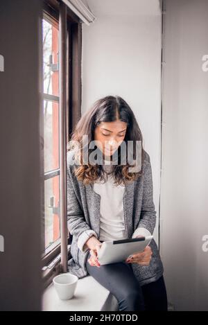 Young businesswoman using tablet Stock Photo