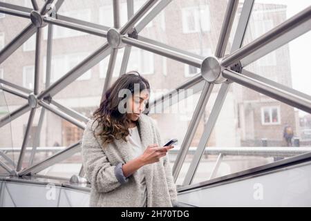 Young woman using smart phone Stock Photo