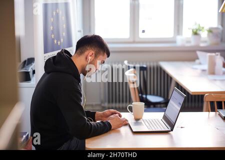 Young man using laptop Stock Photo