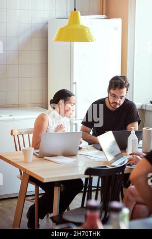 Woman and man using laptops Stock Photo