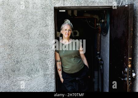 Smiling woman looking at camera Stock Photo