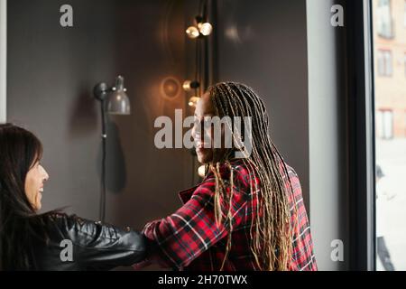 Coworkers talking during coffee break Stock Photo