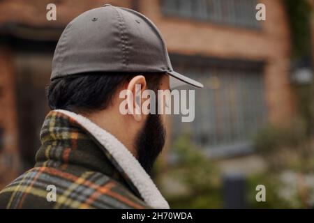 Man in gray baseball cap Stock Photo