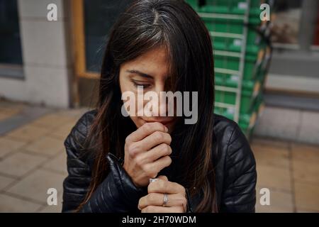 Woman lighting cigarette Stock Photo