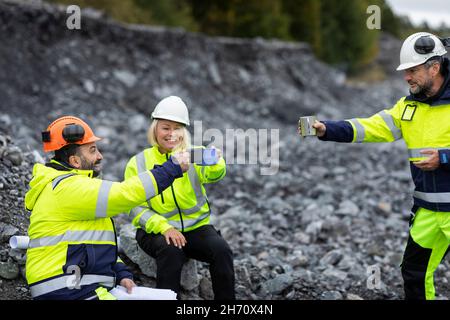 Construction workers having break Stock Photo