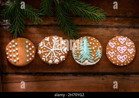 Christmas cookies with icing on wooden background Stock Photo