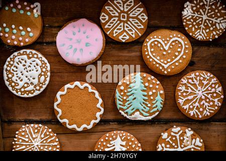 Christmas cookies with icing on wooden background Stock Photo