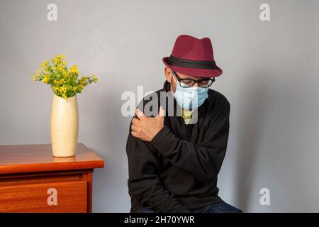 Senior man with shoulder pain. Middle-aged gentleman is in horrible pain. Neck and shoulder pain suffering from neck and shoulder injury, person with Stock Photo