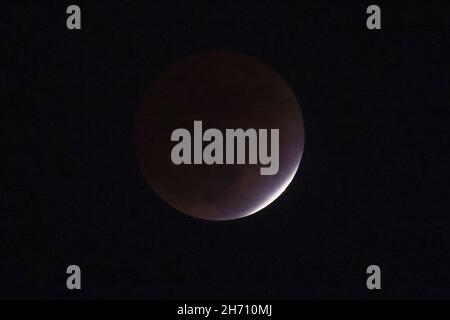 Tokyo, Japan. 19th Nov, 2021. A near-total (partial) lunar eclipse visible from Tokyo. This is the first time in 140 years since December 6, 1881, that it can be seen from all over Japan. The next one will be in 65 years, on November 21, 2086. on November 19, 2021 in Tokyo, Japan. (Photo by Kazuki Oishi/Sipa USA) Credit: Sipa USA/Ģ����ý Live News Stock Photo