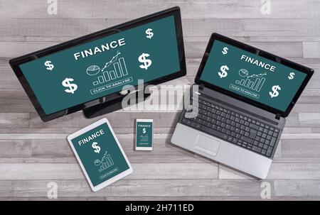 Finance concept shown on different information technology devices Stock Photo