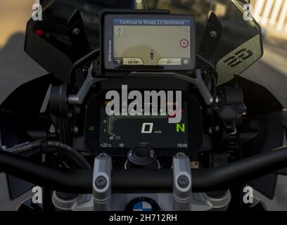 BRASOV, ROMANIA - Sep 13, 2021: A closeup of motorbike turned on dashboard lights and GPS map, Brasov, Romania Stock Photo