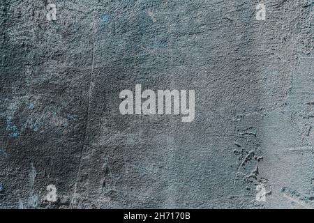 Texture, background, gray concrete wall with rough edges and scratches Stock Photo