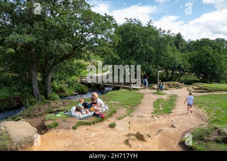 Derbyshire UK – 20 Aug 2020: A family picnic beside Burbage Brook, Longshaw Estate, Peak District Stock Photo