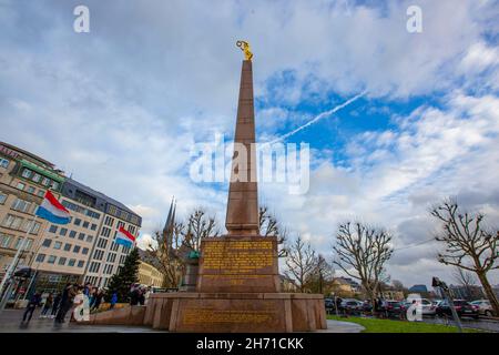 Monument of Remembrance near Constitution Square. It is a Granite obelisk & war memorial nicknamed 'Golden Lady' for its gilded statue. Luxembourg. Stock Photo