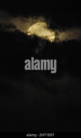 The final phase of the lunar eclipse as behind black cloud from Medan, North Sumatra, Indonesia on November 19, 2021. A partial lunar eclipse is an event that the earth blocks sunlight were not all of light reaches the moon surface for 3.28 hours starting from 16.02.53 Indonesian Western Time. Photo by Sutanta Aditya/ABACAPRESS.COM Stock Photo
