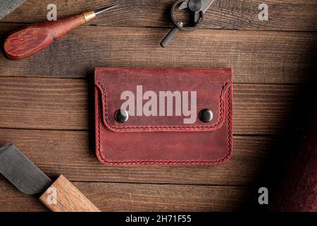 Top view on hand crafted red leather wallet Stock Photo