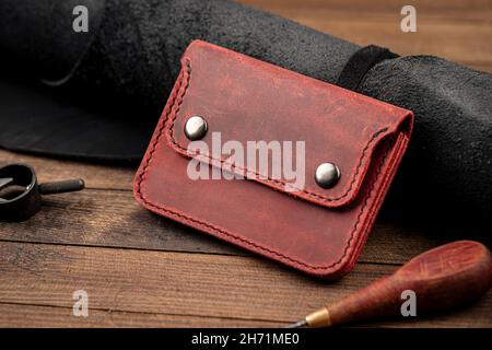 Side view on hand crafted red leather wallet Stock Photo