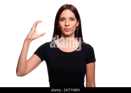 Isolated in white background brunette woman saying letter C  in spanish sign language Stock Photo