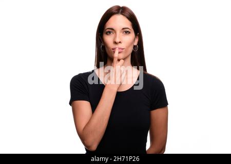 Isolated in white background brunette woman saying red in spanish sign language Stock Photo