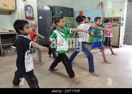 Classroom education, counselling support and first aid techniques provided to street kids. Kolkata, India. Stock Photo